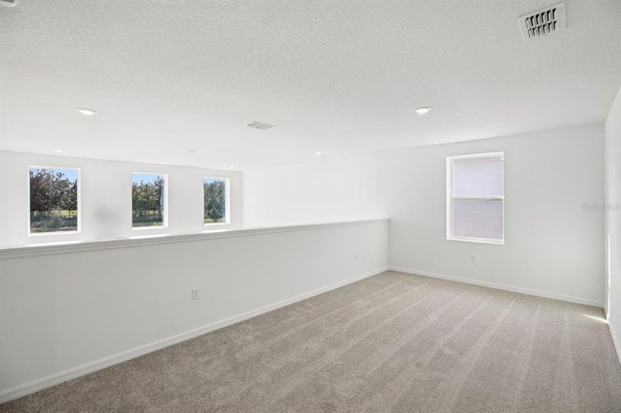 Spacious, unfurnished interior of a new home in Northlake at Ovation, Winter Garden (Image 36).