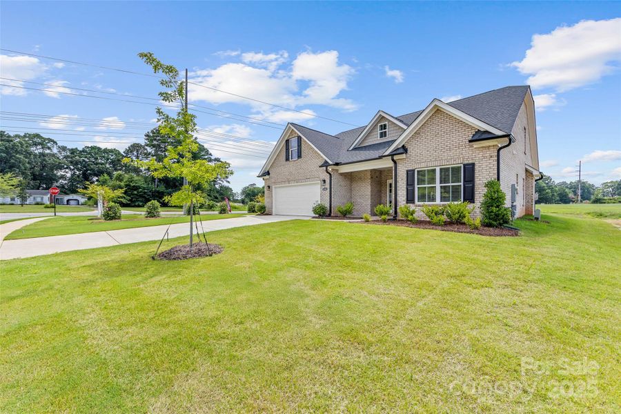 Front exterior of a new home in , Waxhaw, NC, highlighting curb appeal (Image 2). Front exterior of a new home in , Waxhaw, NC, highlighting curb appeal (Image 2).
