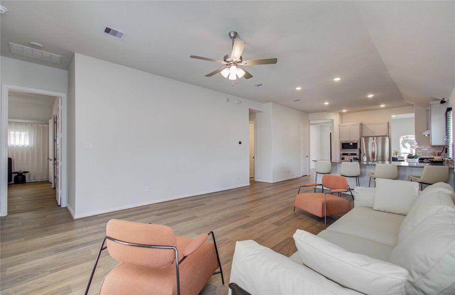 Furnished interior view inside a new home in Sunterra, Katy (Image 15).