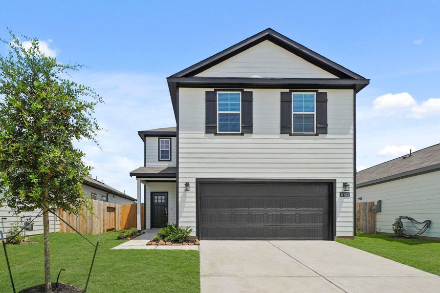 Front exterior of a new home in Lonestar Collection at Paloma at Sanford Farms, Waller, TX, highlighting curb appeal (Image 2).