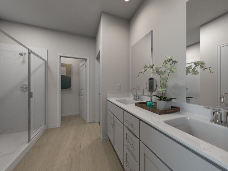 The primary bathroom offers dual vanity sinks and a walk-in closet.