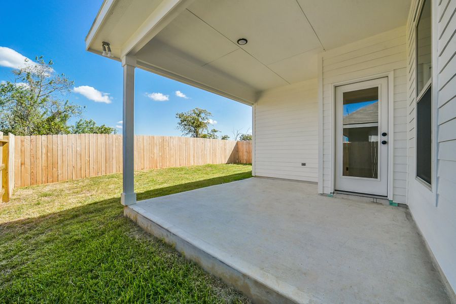 Exterior details and patio area of a home in Mostyn Springs, Magnolia (Image 28).
