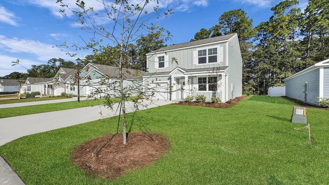 Front exterior of a new home in Hillcrest, Ravenel, SC, highlighting curb appeal (Image 22).