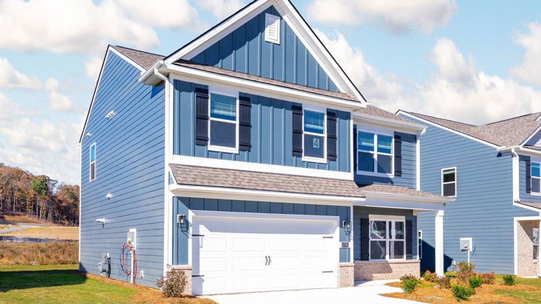 Front exterior of a new home in Prairie Pass, Apison, TN, highlighting curb appeal (Image 2). Front exterior of a new home in Prairie Pass, Apison, TN, highlighting curb appeal (Image 2).