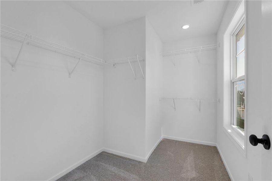 This spacious closet offers ample storage with con