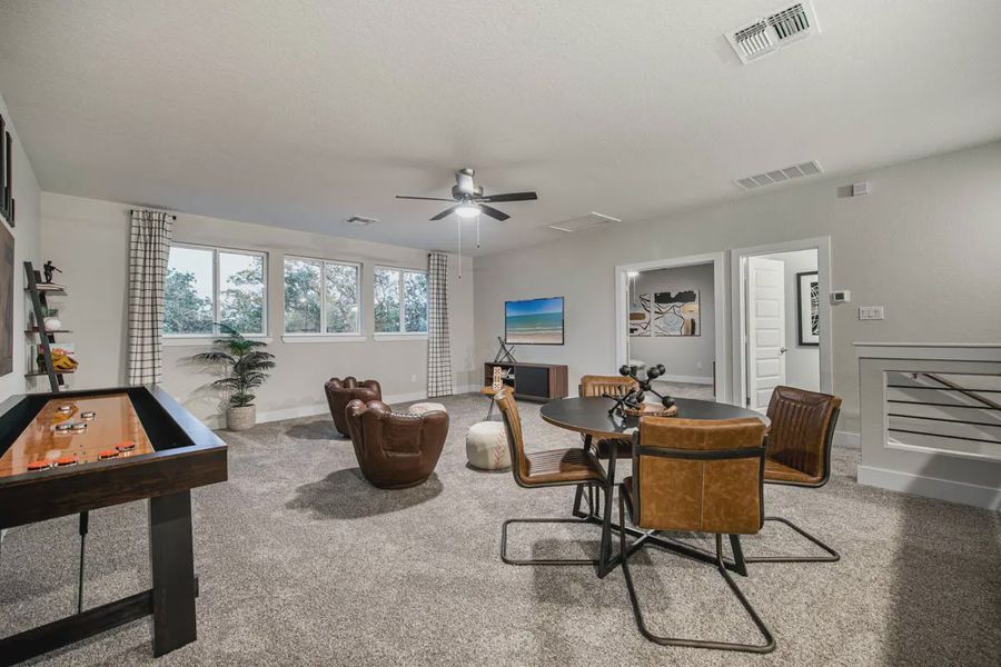 Representative furnished interior of a home built from the Raven by Chesmar Homes in Potranco Oaks 100's, Castroville (Image 15).