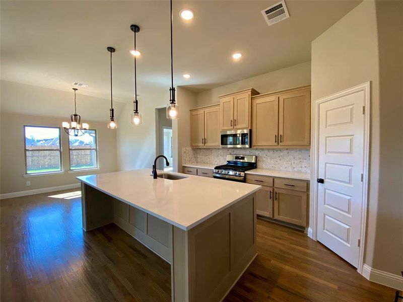 Warm & welcoming colors in kitchen are perfect for entertaining.