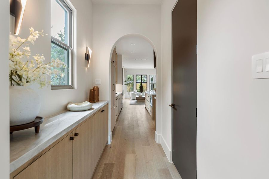 Butler's pantry flooded with natural light with a separate walk-in pantry tucked behind a solid core door. Butler's pantry flooded with natural light with a separate walk-in pantry tucked behind a solid core door.