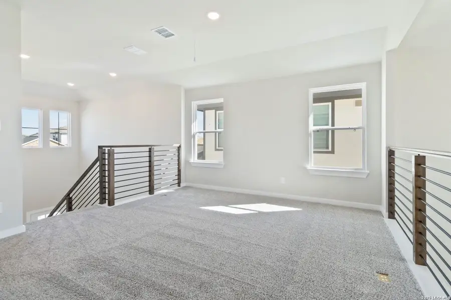 Spacious, unfurnished interior of a new home in Hunters Ranch, San Antonio (Image 22).