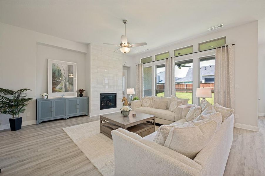 Enjoy effortless move-in-ready living in this light-filled family room, where expansive windows, stylish furnishings, and an open-concept design create the perfect space to relax and entertain. Even better, all living room furniture conveys with the home, offering exceptional value and convenience for the next owner Enjoy effortless move-in-ready living in this light-filled family room, where expansive windows, stylish furnishings, and an open-concept design create the perfect space to relax and entertain. Even better, all living room furniture conveys with the home, offering exceptional value and convenience for the next owner