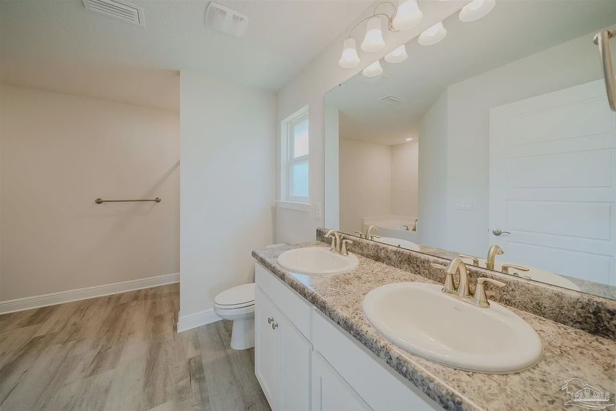 Furnished interior view inside a new home in Pine Top, Cantonment (Image 6).