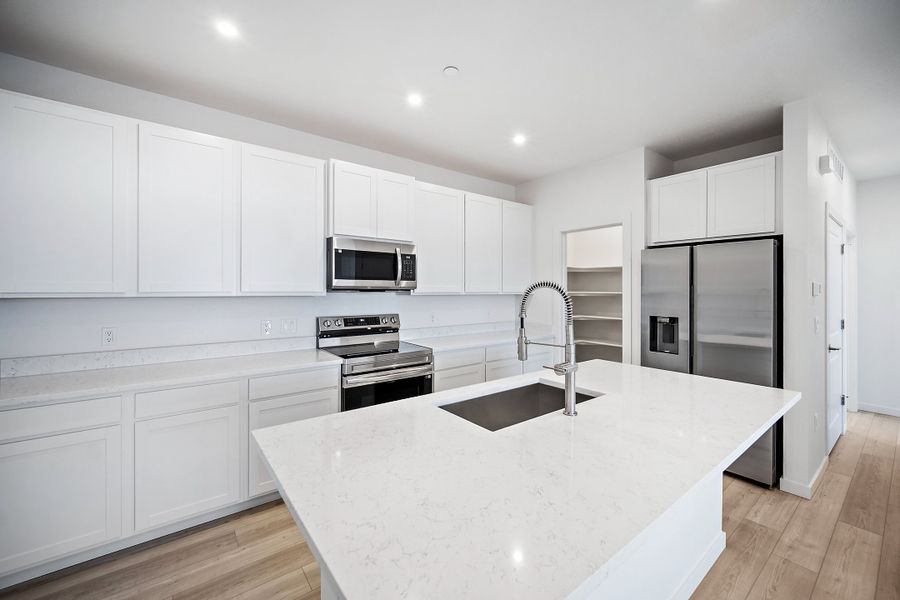 Furnished interior view inside a new home in Lyric at RidgeGate Condos, Lone Tree (Image 5).