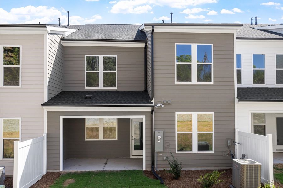 Exterior details and patio area of a home in Ovation at Sweetbrier, Durham (Image 4).