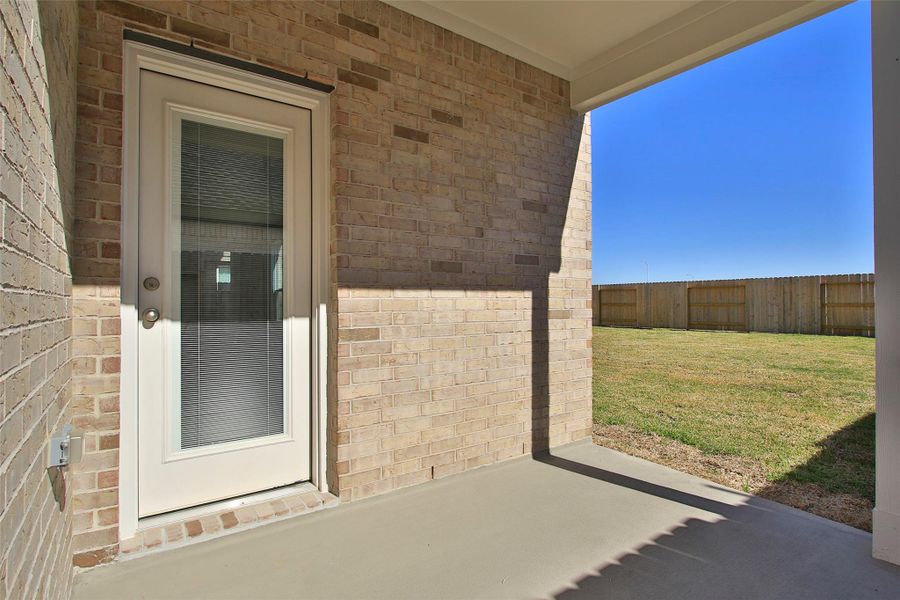 Exterior details and patio area of a home in Sunterra, Katy (Image 3).
