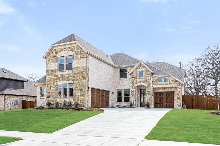 Front exterior of a new home in Rockwood, Mansfield, TX, highlighting curb appeal (Image 2).