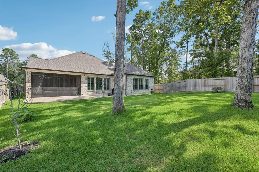 Exterior details and patio area of a home in The Woodlands Hills, Willis (Image 4).