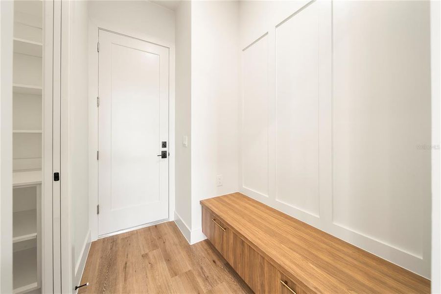 A built-in mudroom allows for a seamless transition into your home