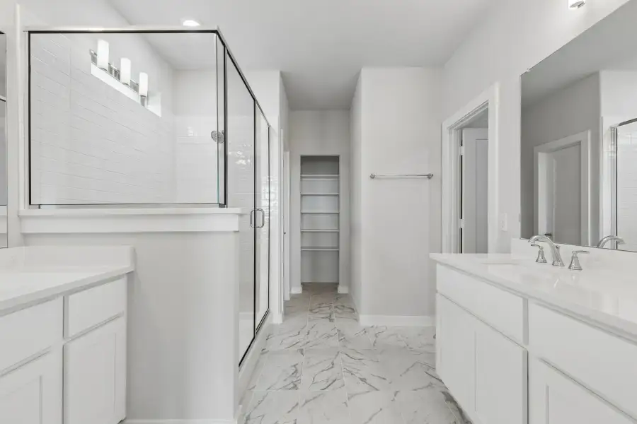 Primary Bathroom in the Winters home plan by Trophy Signature Homes – REPRESENTATIVE PHOTO