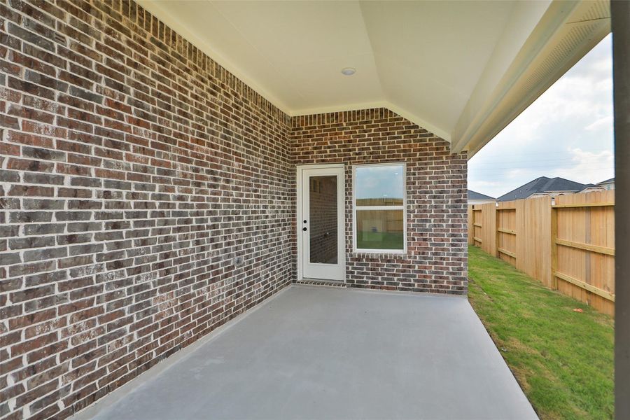Exterior details and patio area of a home in Creekhaven, Iowa Colony (Image 3). Exterior details and patio area of a home in Creekhaven, Iowa Colony (Image 3).