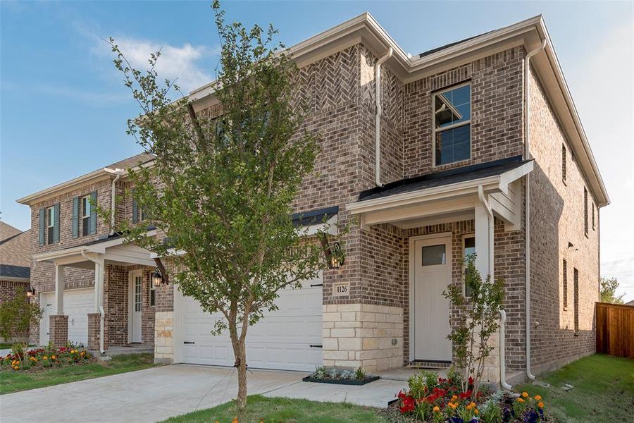 Front exterior of a new home in Walden Pond, Forney, TX, highlighting curb appeal (Image 22). Front exterior of a new home in Walden Pond, Forney, TX, highlighting curb appeal (Image 22).