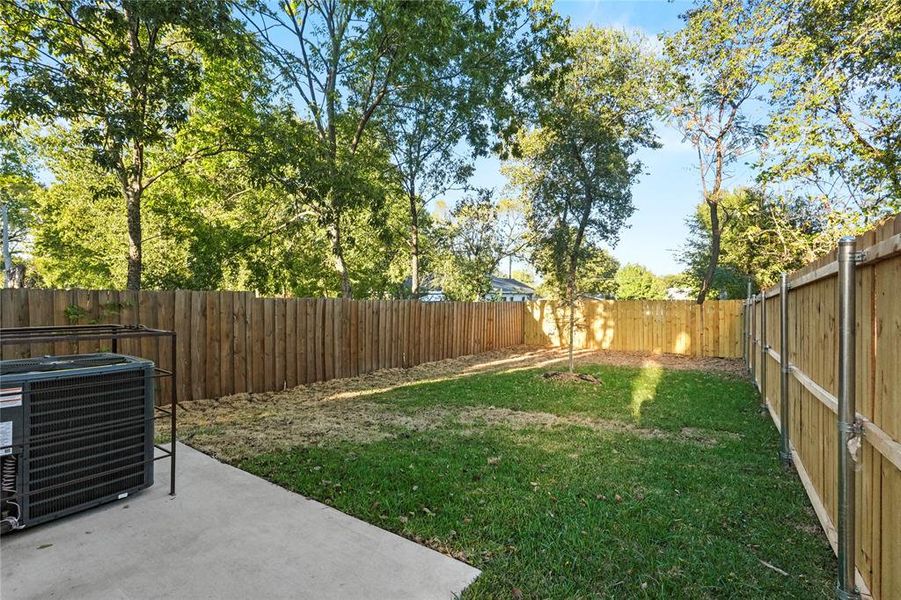 Fenced backyard with a patio Fenced backyard with a patio