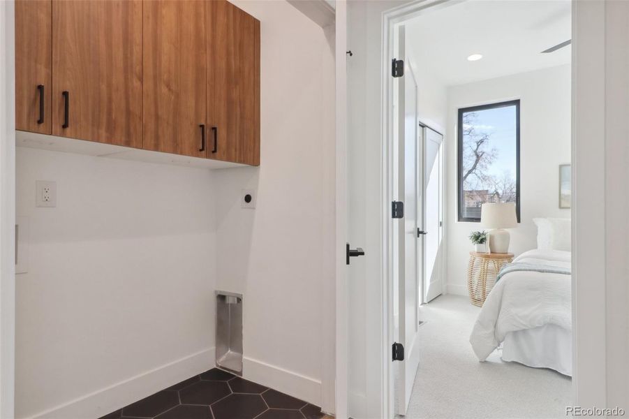 2nd floor laundry closet with built in storage