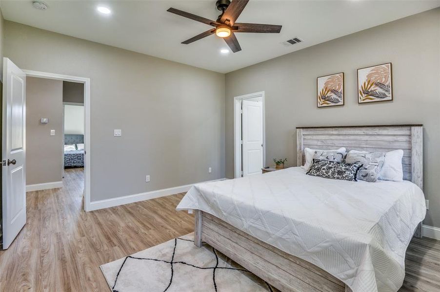 Bedroom featuring light wood-type flooring, recessed lighting, and a ceiling fan