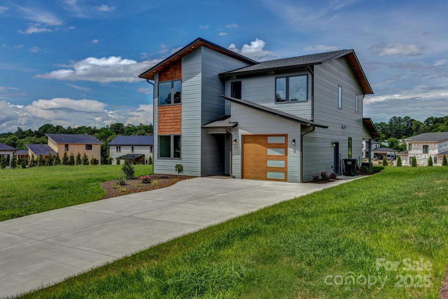Front exterior of a new home in , Asheville, NC, highlighting curb appeal (Image 1). Front exterior of a new home in , Asheville, NC, highlighting curb appeal (Image 1).