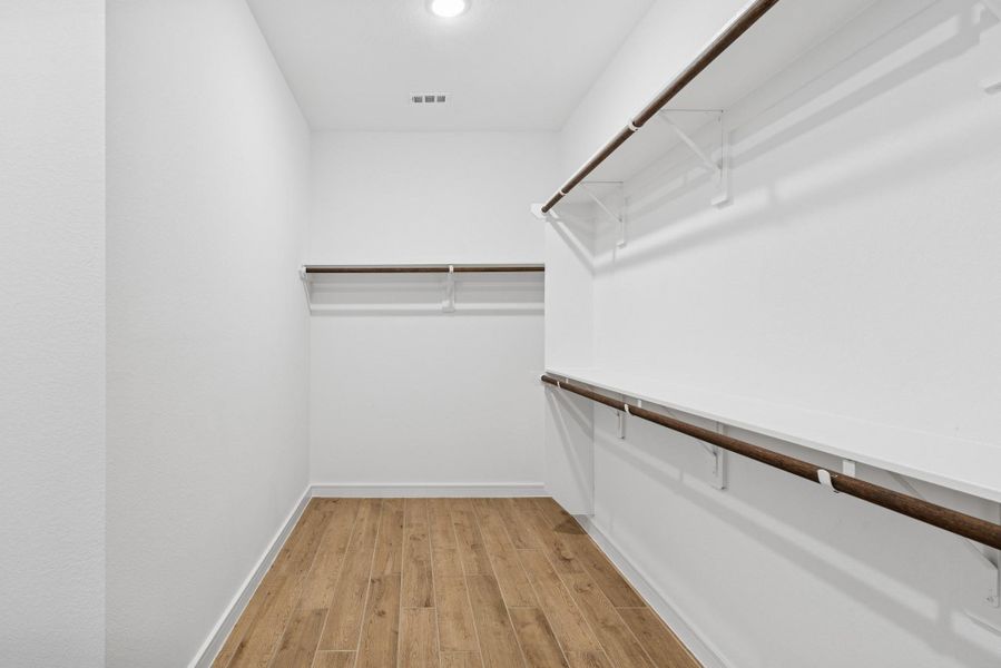 Primary walk-in closet (*Photo not of actual home and used for illustration purposes only.) Primary walk-in closet (*Photo not of actual home and used for illustration purposes only.)