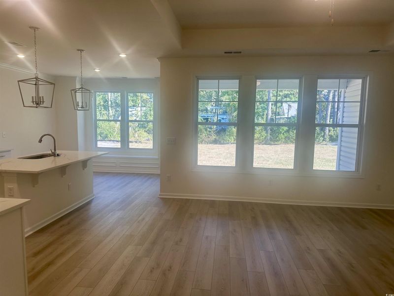 Doorway to outside featuring recessed lighting and wood finished floors