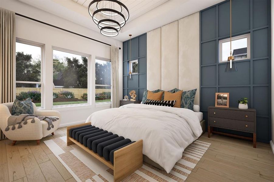 Bedroom featuring a decorative wall and light wood-style flooring