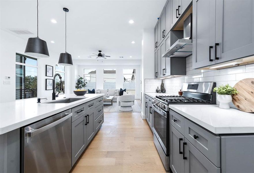 Stainless stell appliances come standard with this beauty!  Lots of countertop and tons of natural lighting.