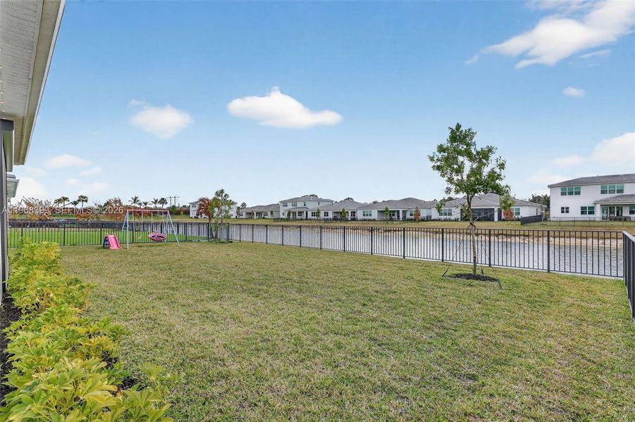 Fully fenced yard provides safety for children and pets while embracing the relaxing Florida lakeview lifestyle.