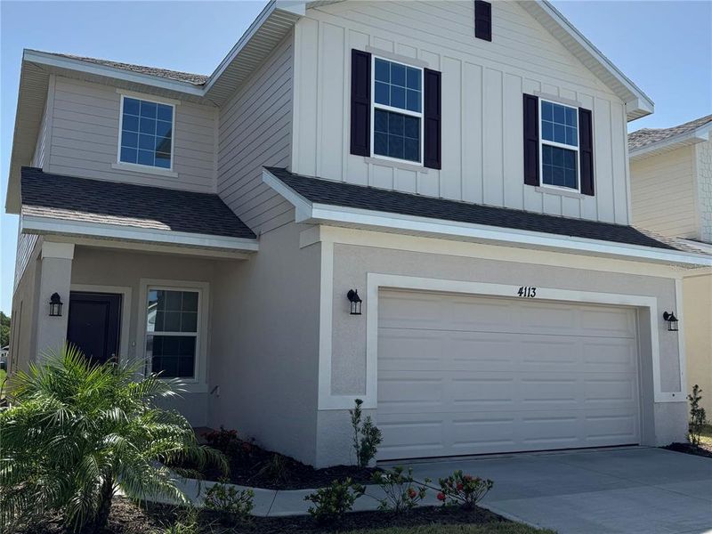 Front exterior of a new home in Harmony Central, Harmony, FL, highlighting curb appeal (Image 17). Front exterior of a new home in Harmony Central, Harmony, FL, highlighting curb appeal (Image 17).