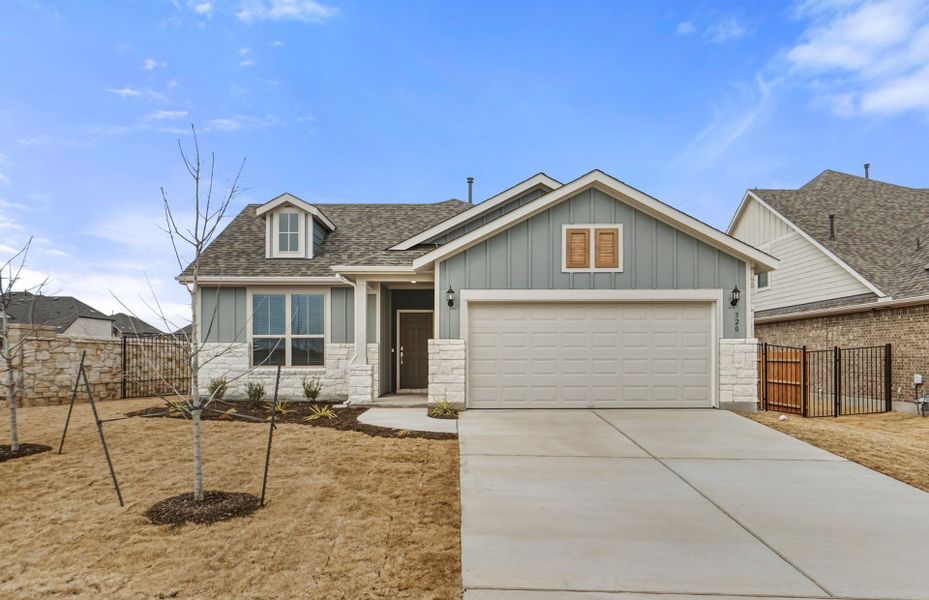 Front exterior of a new home in Saddleback at Santa Rita Ranch, Liberty Hill, TX, highlighting curb appeal (Image 2). Front exterior of a new home in Saddleback at Santa Rita Ranch, Liberty Hill, TX, highlighting curb appeal (Image 2).