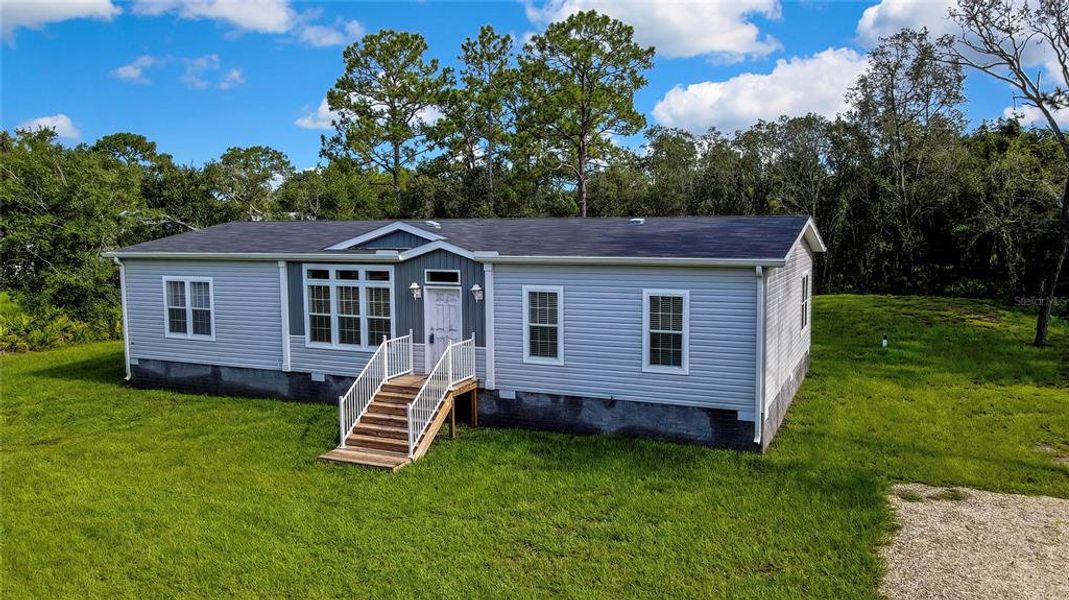 Front exterior of a new home in , Homosassa, FL, highlighting curb appeal (Image 27).