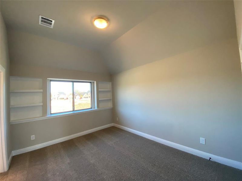 Bed 4 has vaulted ceiling, built-in shelves, and shares a Jack & Jill bath Bed 4 has vaulted ceiling, built-in shelves, and shares a Jack & Jill bath