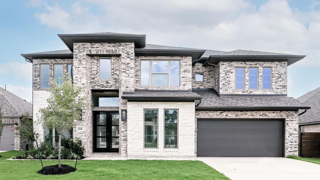 Front exterior of a new home in Juniper Springs, Lockhart, TX, highlighting curb appeal (Image 1). Front exterior of a new home in Juniper Springs, Lockhart, TX, highlighting curb appeal (Image 1).
