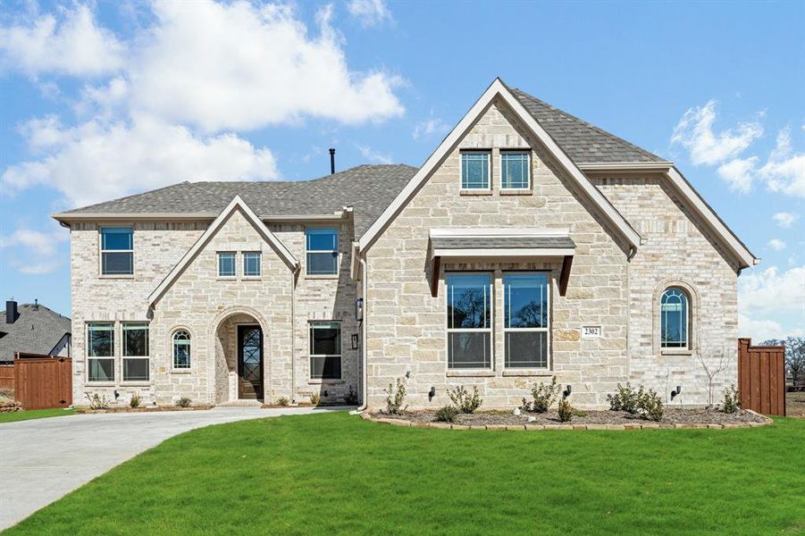 Front exterior of a new home in Rockwood, Mansfield, TX, highlighting curb appeal (Image 2).