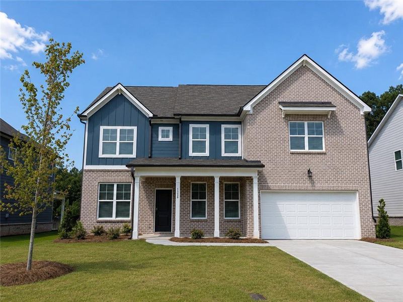 Front exterior of a new home in Kingsmere Estates, Loganville, GA, highlighting curb appeal (Image 1). Front exterior of a new home in Kingsmere Estates, Loganville, GA, highlighting curb appeal (Image 1).