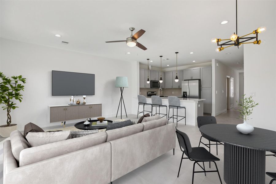 Living room with concrete floors, a ceiling fan, and a chandelier