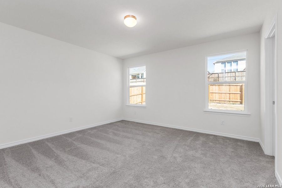 Spacious, unfurnished interior of a new home in Hidden Bluffs at TRP, San Antonio (Image 12).