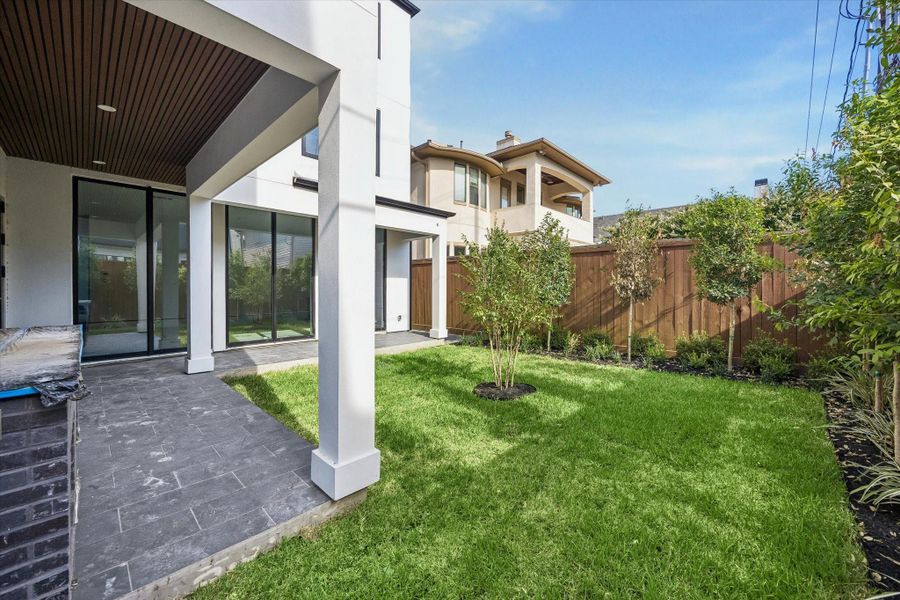 Backyard with covered patio. Backyard with covered patio.