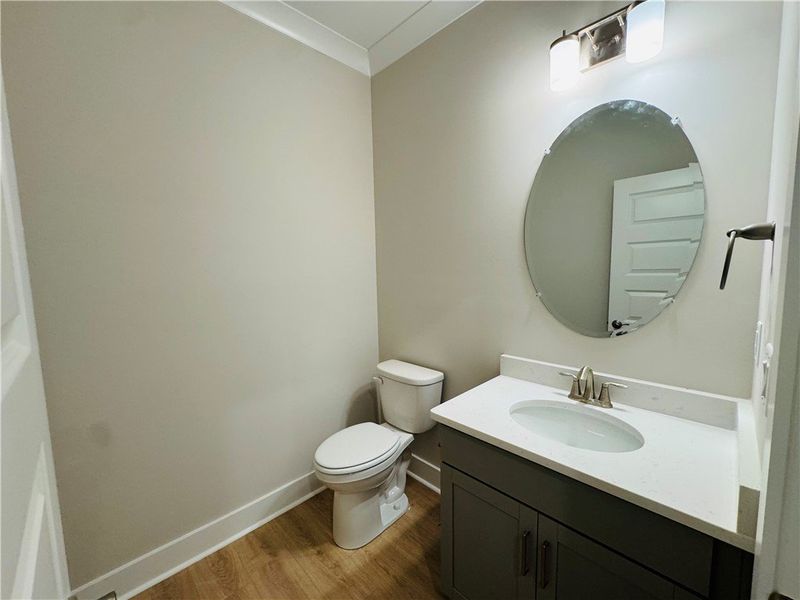 This clean and bright bathroom features a modern v