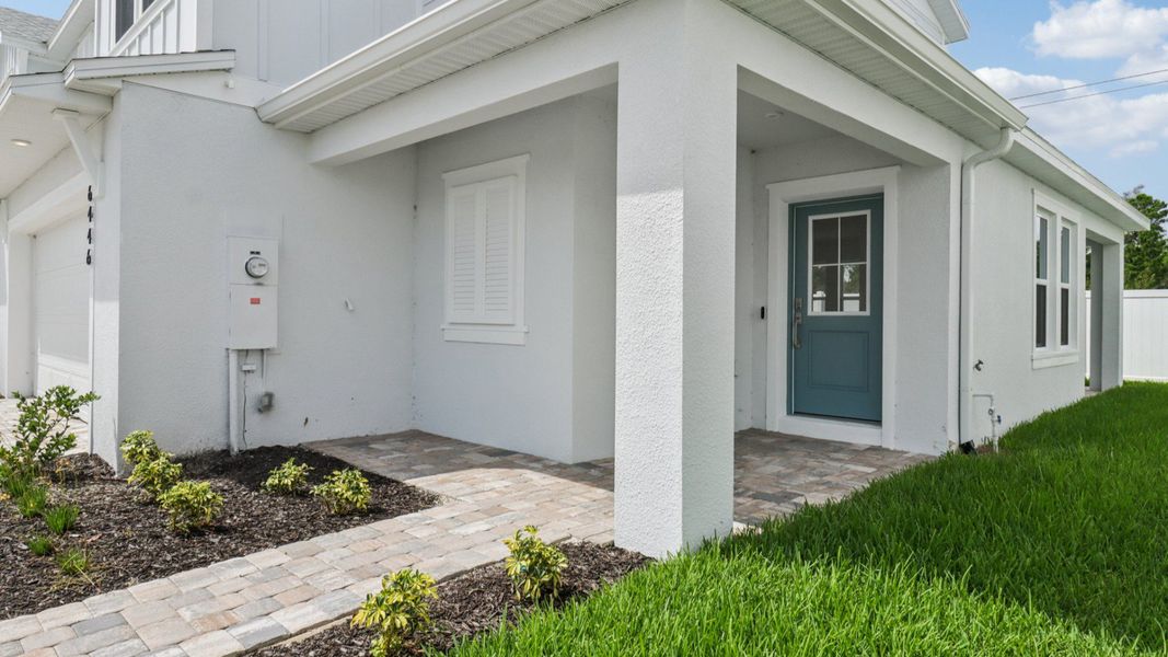 Exterior Monterey End Townhome by DRB Homes - Cyrene at Harmony in St Cloud FL