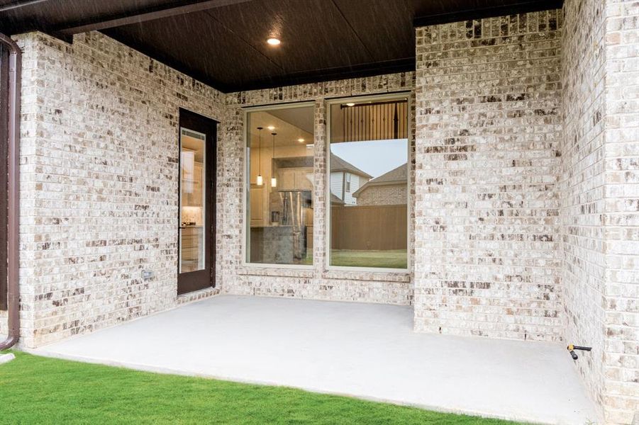 Exterior details and patio area of a home in Woodstone, Providence Village (Image 4). Exterior details and patio area of a home in Woodstone, Providence Village (Image 4).