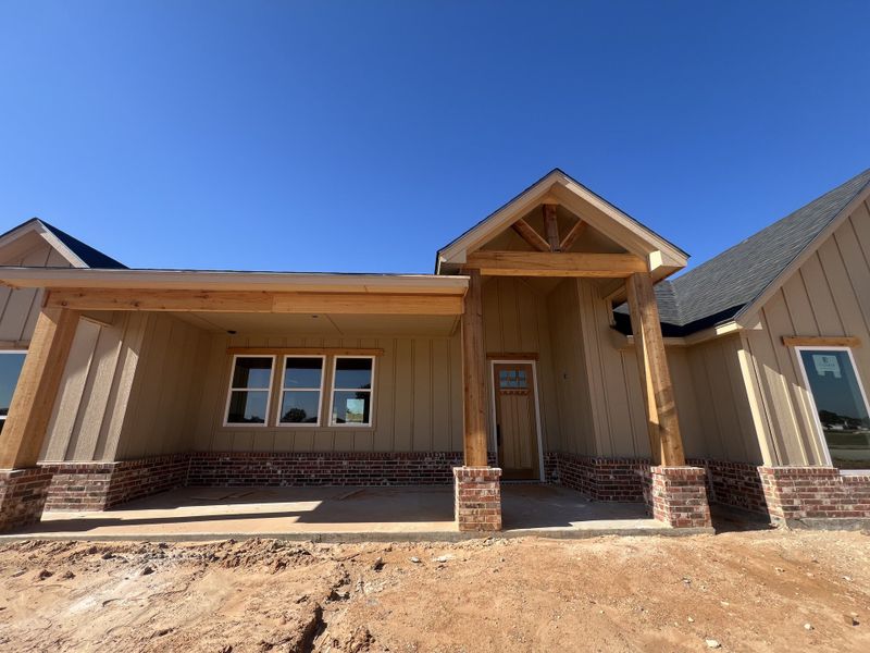 Front exterior of a new home in Zion Valley, Poolville, TX, highlighting curb appeal (Image 2).