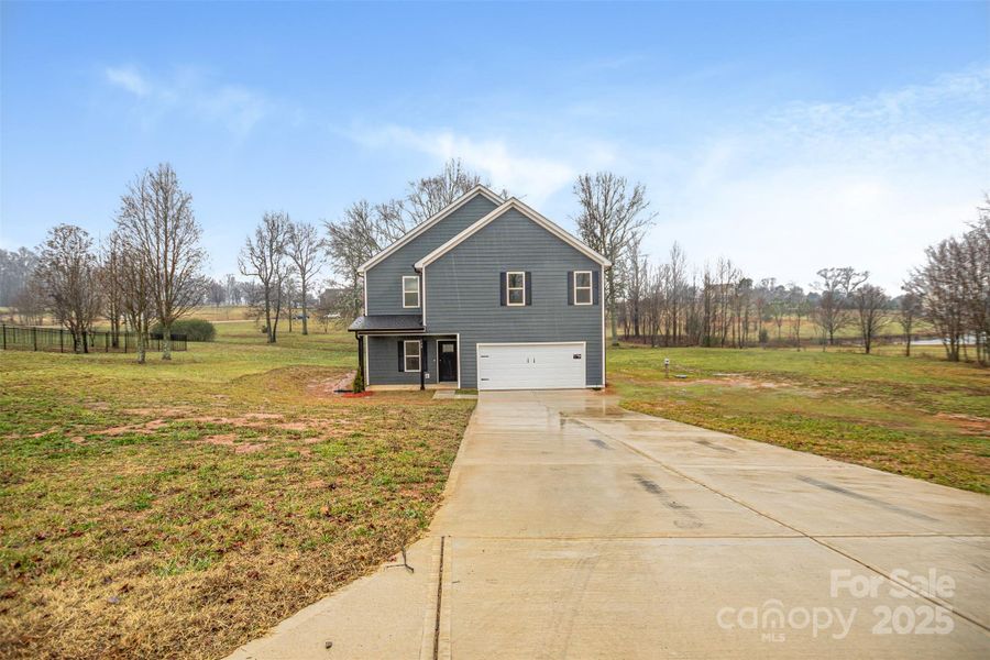 Front exterior of a new home in , Shelby, NC, highlighting curb appeal (Image 17).