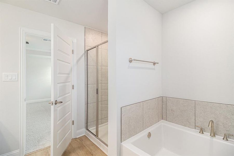 Primary Bathroom with Separate Shower and Bathtub