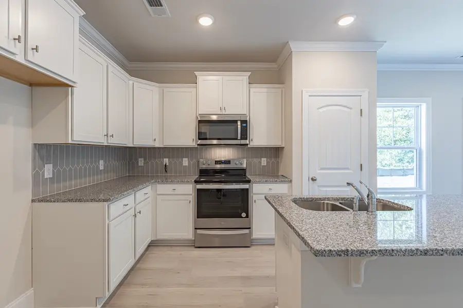 Representative furnished interior of a home built from the Habersham II by Great Southern Homes in Old Charleston Acres, Pelion (Image 5).